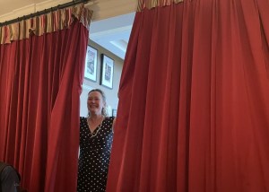 The woman behind the curtain